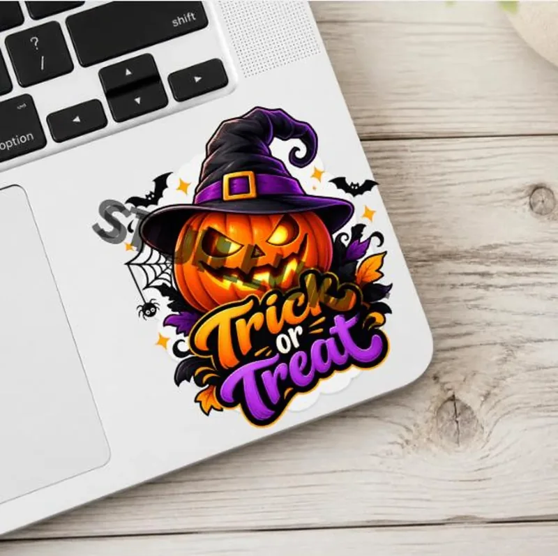 Halloween pumpkin Trick or Treat design with witch hat, bats and purple orange lettering
