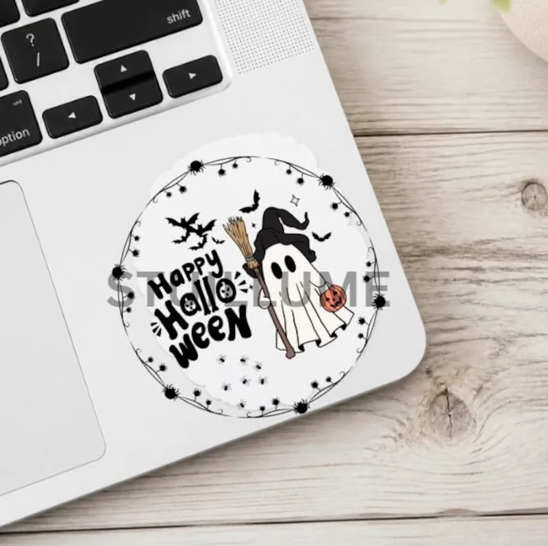 Cute Halloween ghost wearing a witch hat with broom and jack-o-lantern bucket, surrounded by bats and spiders on a pink background