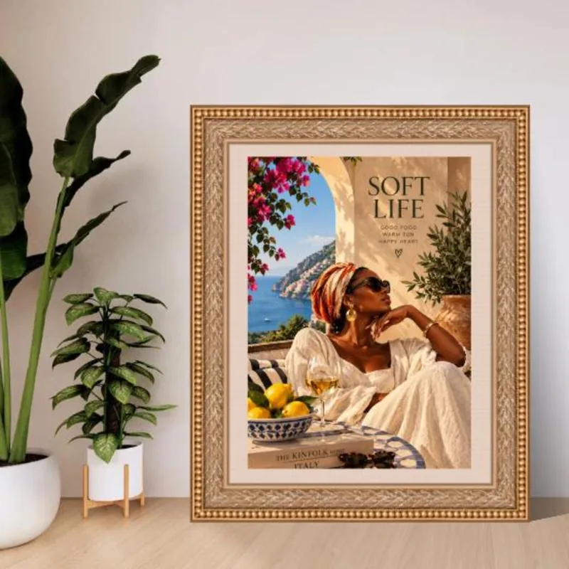 Soft Life artwork — woman in a white dress and patterned headscarf relaxing on an Amalfi Coast terrace with lemons, a glass of wine, and pink bougainvillea by the sea